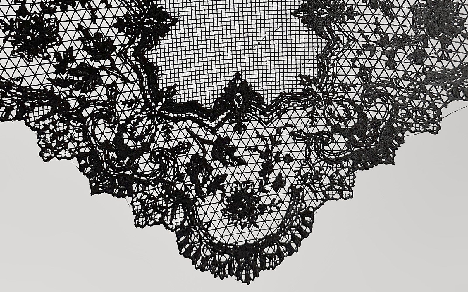 Close-up of the edge of a 3D printed black lace handkerchief